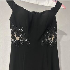 Black off the shoulder dress with meshed side cut outs and jeweled